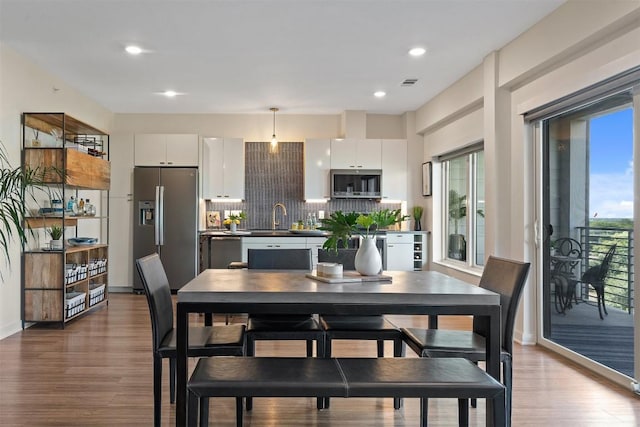 4361 S Congress Ave Unit 435, Austin, TX 78745 - dining area featuring wood finished floors and recessed lighting