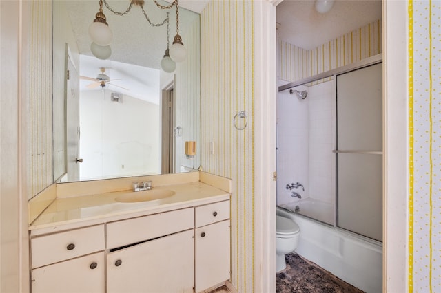 11702 Shoshone Dr, Austin, TX 78759 - bathroom with wallpapered walls, vanity, a ceiling fan, and shower / bath combination with glass door