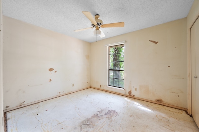 11702 Shoshone Dr, Austin, TX 78759 - empty room with a textured ceiling and ceiling fan