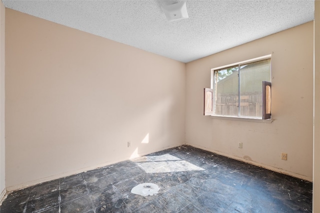 11702 Shoshone Dr, Austin, TX 78759 - unfurnished room featuring a textured ceiling