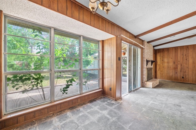 11702 Shoshone Dr, Austin, TX 78759 - unfurnished sunroom with plenty of natural light, a chandelier, and vaulted ceiling