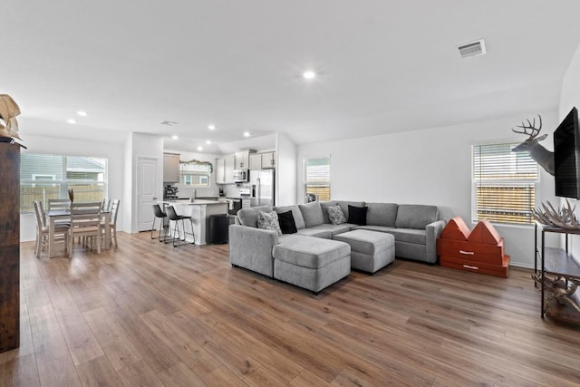 105 Perfect World Loop, Jarrell, TX 76537 - living room with wood finished floors, healthy amount of natural light, and recessed lighting