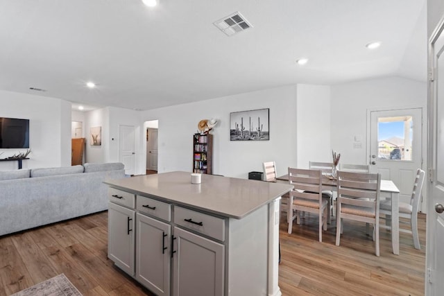 105 Perfect World Loop, Jarrell, TX 76537 - kitchen featuring light wood-type flooring, a center island, light countertops, recessed lighting, and open floor plan