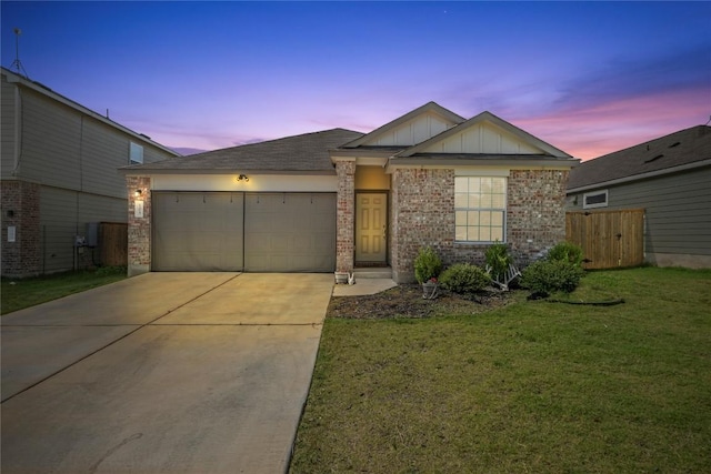 105 Perfect World Loop, Jarrell, TX 76537 - ranch-style house featuring an attached garage, board and batten siding, driveway, and brick siding