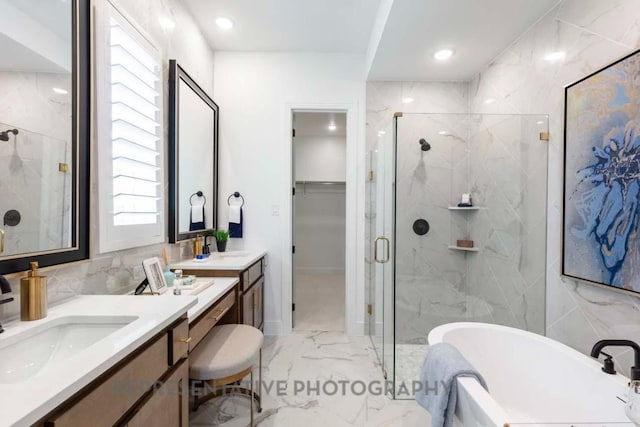 1401 Snowdrop Dr, Georgetown, TX 78628 - full bathroom featuring marble tiled floors, a marble finish shower, a soaking tub, vanity, and recessed lighting
