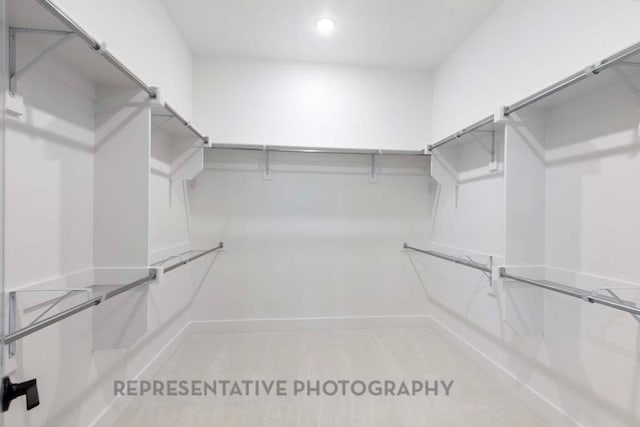 1401 Snowdrop Dr, Georgetown, TX 78628 - walk in closet featuring carpet