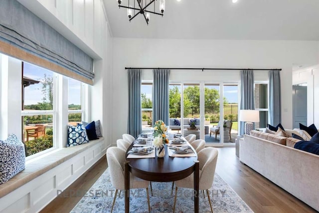1401 Snowdrop Dr, Georgetown, TX 78628 - dining space with dark wood-type flooring, a chandelier, and high vaulted ceiling