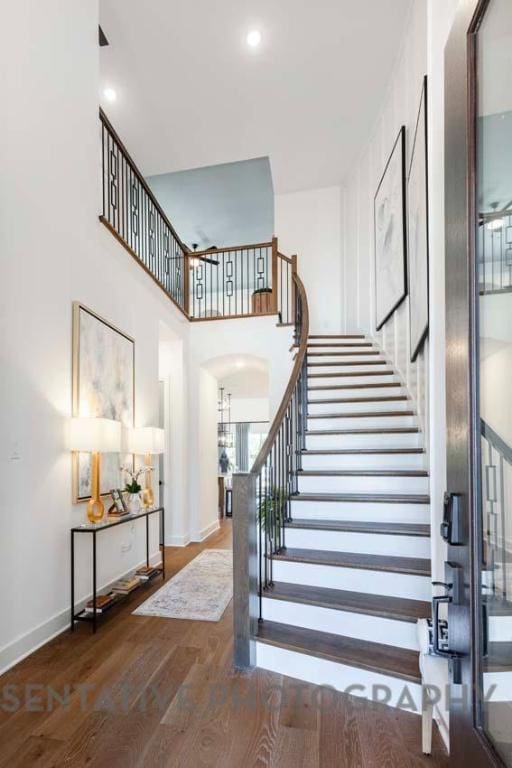 1401 Snowdrop Dr, Georgetown, TX 78628 - stairs with wood finished floors and arched walkways