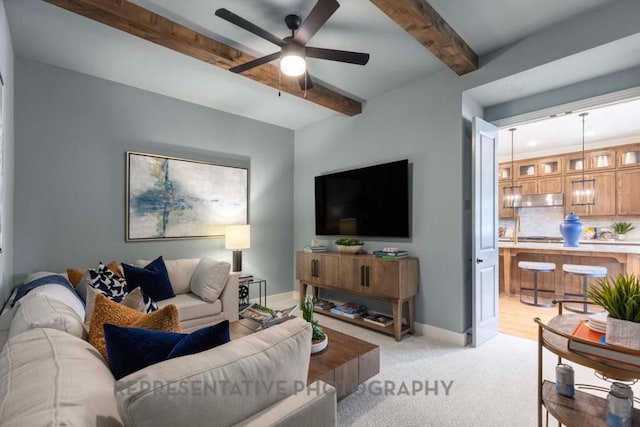 1401 Snowdrop Dr, Georgetown, TX 78628 - living room featuring beamed ceiling, ceiling fan, and light colored carpet