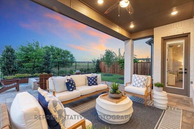 1401 Snowdrop Dr, Georgetown, TX 78628 - fenced backyard featuring outdoor lounge area, a patio area, and a ceiling fan