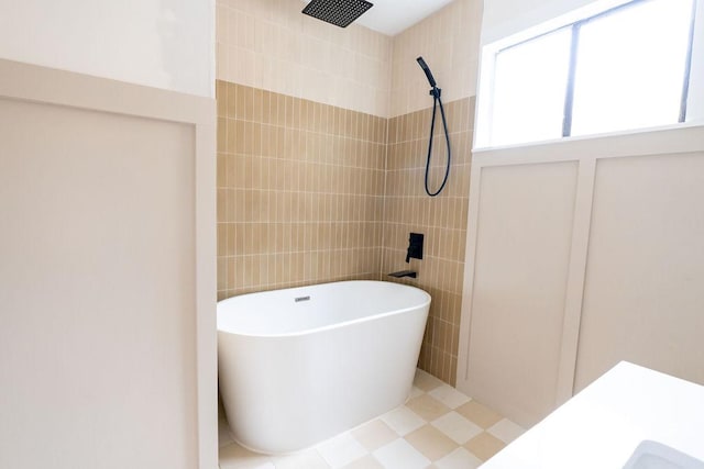 11436 Bristle Oak Trl, Austin, TX 78750 - full bath featuring a soaking tub, tiled shower, and tile walls