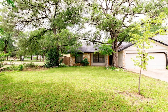 11436 Bristle Oak Trl, Austin, TX 78750 - view of front of home with a garage, concrete driveway, a front lawn, and stone siding