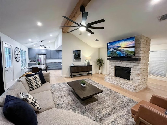 1701 Woodwind Ln, Austin, TX 78758 - living room featuring a ceiling fan, light wood-type flooring, a fireplace, and recessed lighting