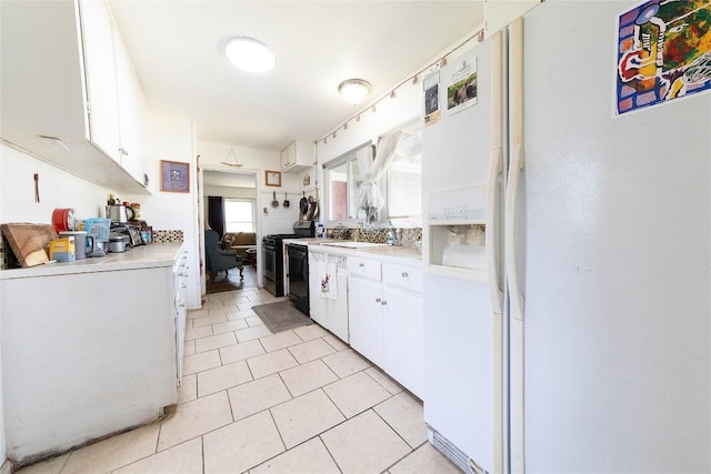 936 Cheatham St, San Marcos, TX 78666 - kitchen featuring white fridge with ice dispenser, range, light countertops, white cabinets, and light tile patterned floors