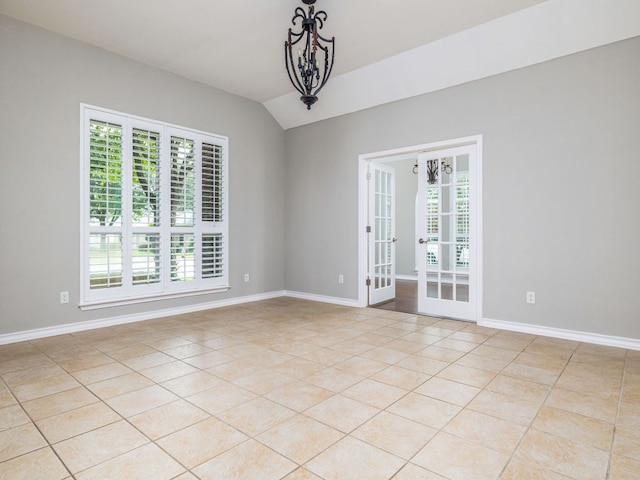 17029 Ennis Trl, Austin, TX 78717 - spare room with light tile patterned floors, french doors, a chandelier, and vaulted ceiling