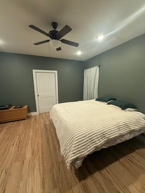 305 Goertz Dr, Red Rock, TX 78662 - bedroom with wood finished floors, a ceiling fan, and recessed lighting