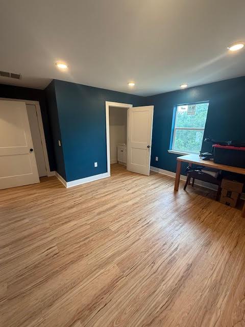 305 Goertz Dr, Red Rock, TX 78662 - unfurnished bedroom with light wood finished floors and recessed lighting
