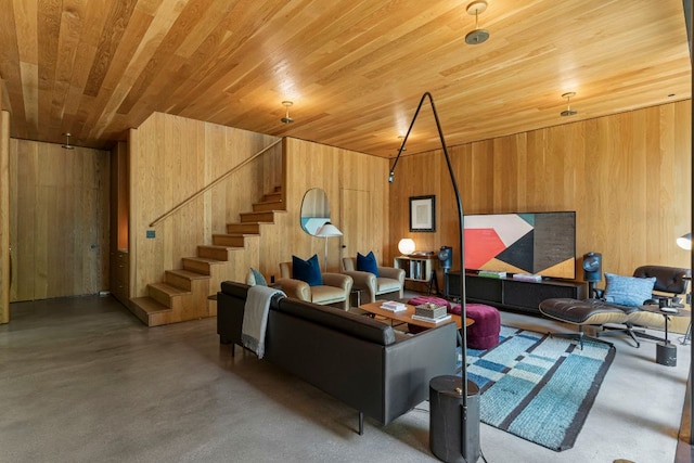 906 W 18th St, Austin, TX 78701 - living area with concrete floors, wooden walls, wooden ceiling, and stairs