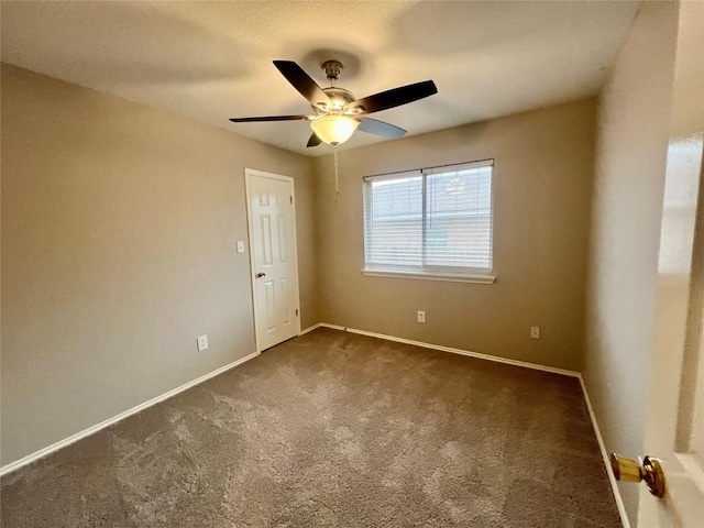 612 Thrush Dr, Leander, TX 78641 - spare room featuring dark colored carpet and ceiling fan
