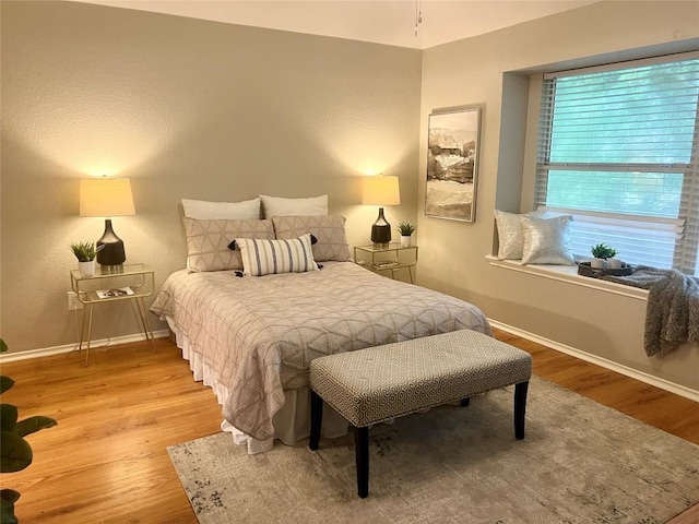 612 Thrush Dr, Leander, TX 78641 - bedroom with baseboards and wood finished floors