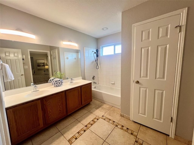 612 Thrush Dr, Leander, TX 78641 - full bathroom featuring double vanity, tile patterned floors, and bathing tub / shower combination