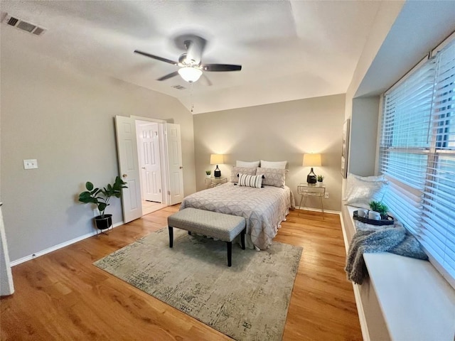 612 Thrush Dr, Leander, TX 78641 - bedroom featuring light wood finished floors, vaulted ceiling, and ceiling fan