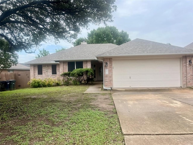 612 Thrush Dr, Leander, TX 78641 - ranch-style home with brick siding, an attached garage, concrete driveway, a chimney, and a shingled roof
