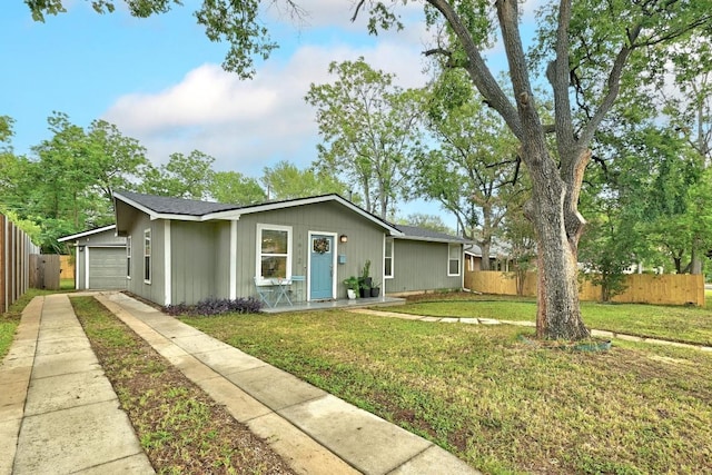 1612 Westmoor Dr, Austin, TX 78723 - ranch-style home with concrete driveway and an attached garage