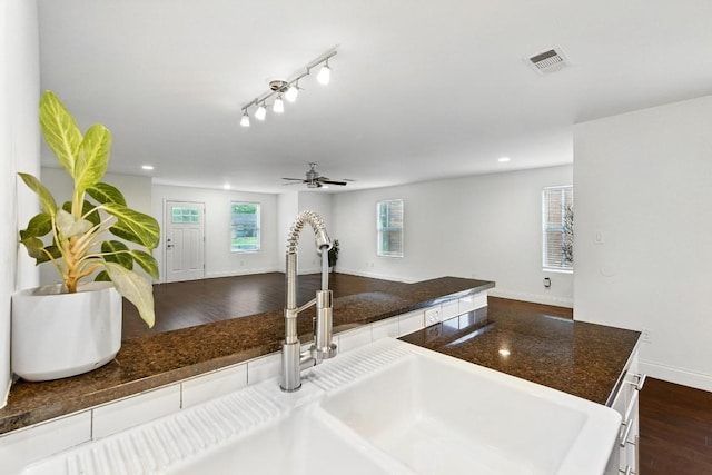 1612 Westmoor Dr, Austin, TX 78723 - kitchen featuring dark countertops, a ceiling fan, open floor plan, recessed lighting, and dark wood finished floors