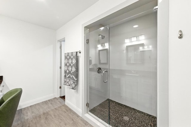 1612 Westmoor Dr, Austin, TX 78723 - full bathroom featuring a shower stall, wood finished floors, and a freestanding tub