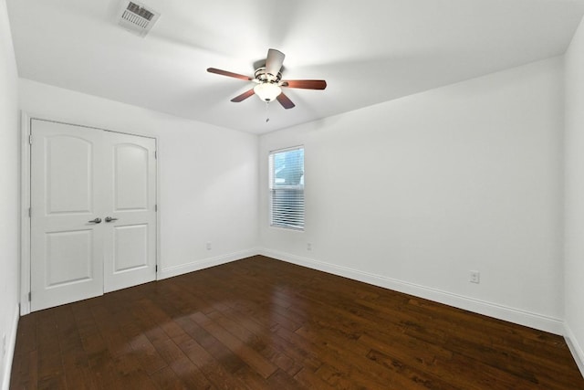 1612 Westmoor Dr, Austin, TX 78723 - unfurnished bedroom with dark wood-style floors, a ceiling fan, and a closet