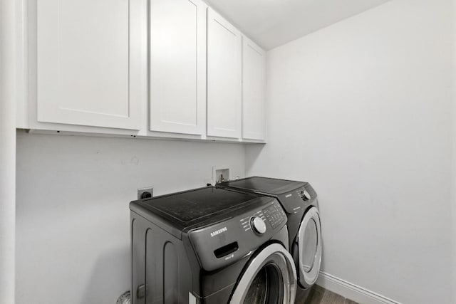 1612 Westmoor Dr, Austin, TX 78723 - washroom featuring cabinet space, separate washer and dryer, and wood finished floors