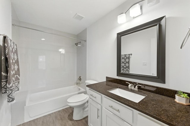 1612 Westmoor Dr, Austin, TX 78723 - full bathroom featuring vanity, bathing tub / shower combination, and wood finished floors