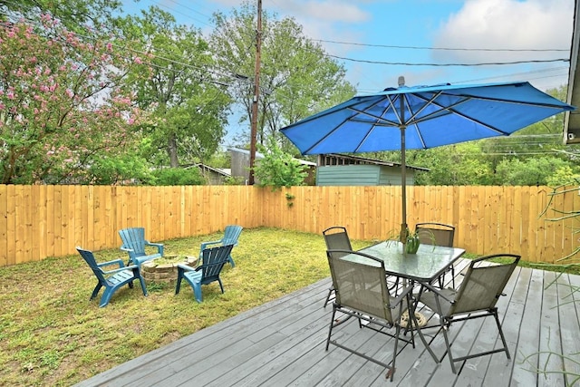 1612 Westmoor Dr, Austin, TX 78723 - deck featuring a fenced backyard, outdoor dining area, and an outdoor fire pit