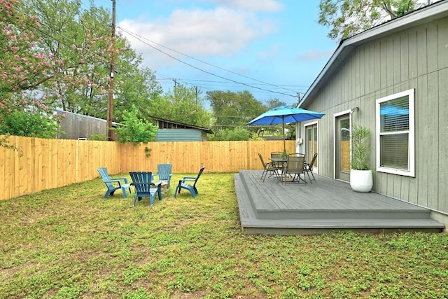 1612 Westmoor Dr, Austin, TX 78723 - fenced backyard with a deck and outdoor dining space