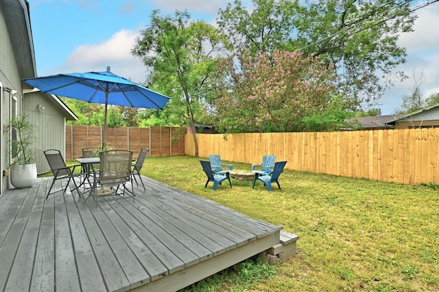 1612 Westmoor Dr, Austin, TX 78723 - deck featuring outdoor dining space, a fenced backyard, and a fire pit