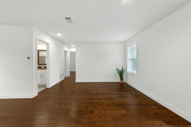 1612 Westmoor Dr, Austin, TX 78723 - empty room featuring dark wood finished floors and recessed lighting