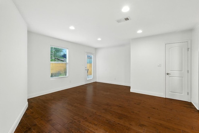 1612 Westmoor Dr, Austin, TX 78723 - empty room with dark wood-style floors and recessed lighting