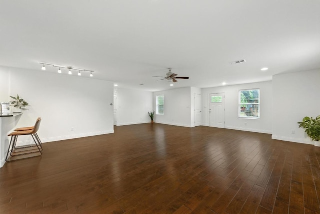 1612 Westmoor Dr, Austin, TX 78723 - unfurnished living room with ceiling fan, dark wood-style floors, healthy amount of natural light, and recessed lighting