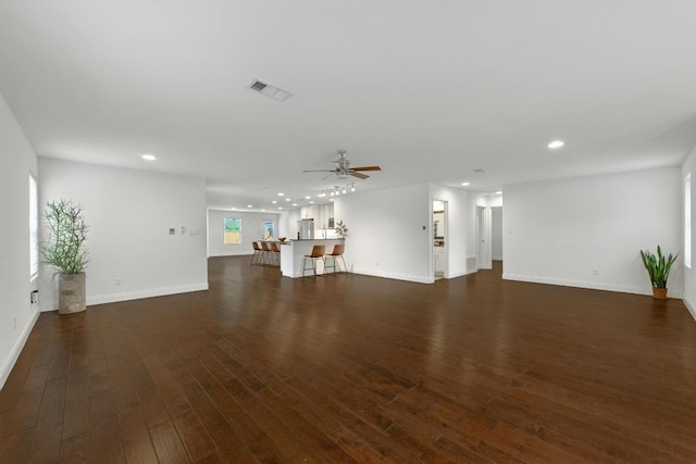 1612 Westmoor Dr, Austin, TX 78723 - unfurnished living room featuring recessed lighting, ceiling fan, and dark wood-type flooring