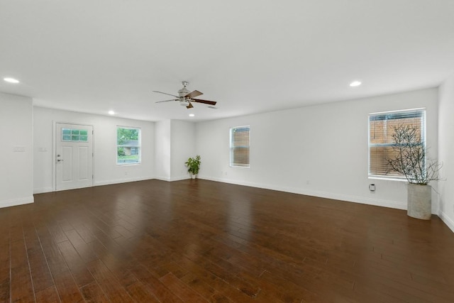 1612 Westmoor Dr, Austin, TX 78723 - unfurnished living room with ceiling fan, recessed lighting, and dark wood-type flooring