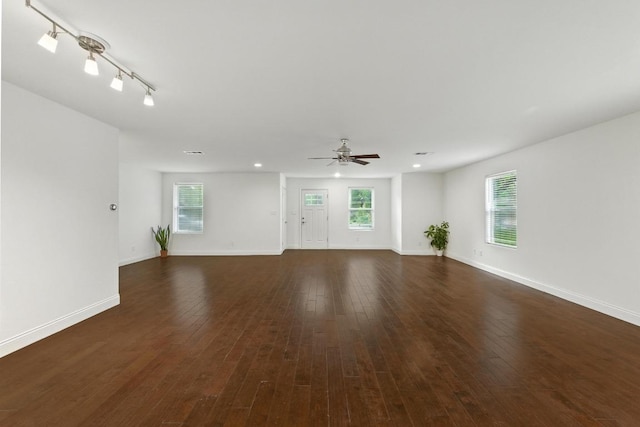1612 Westmoor Dr, Austin, TX 78723 - unfurnished living room with ceiling fan, dark wood-type flooring, and recessed lighting