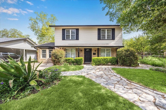 8516 Rockwood Ln, Austin, TX 78757 - traditional-style house with brick siding and covered porch