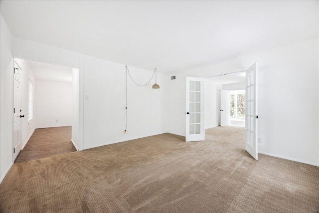 8516 Rockwood Ln, Austin, TX 78757 - unfurnished room featuring french doors and carpet flooring