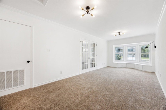 8516 Rockwood Ln, Austin, TX 78757 - empty room with carpet flooring, ornamental molding, and french doors