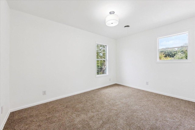 8516 Rockwood Ln, Austin, TX 78757 - carpeted spare room featuring baseboards