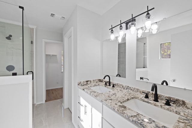10001 Woodglen Dr, Austin, TX 78753 - bathroom with a stall shower, double vanity, and marble finish flooring