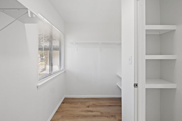10001 Woodglen Dr, Austin, TX 78753 - walk in closet with wood finished floors