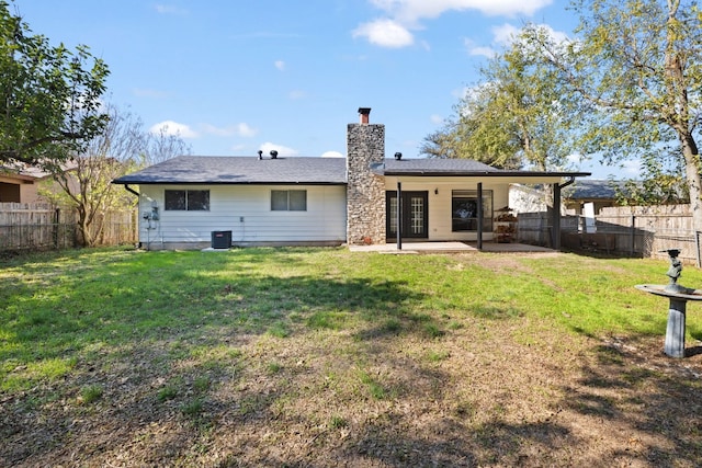 10001 Woodglen Dr, Austin, TX 78753 - back of house featuring a patio area, a chimney, and a fenced backyard