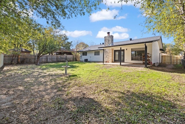 10001 Woodglen Dr, Austin, TX 78753 - rear view of property featuring a chimney, a patio area, and a fenced backyard